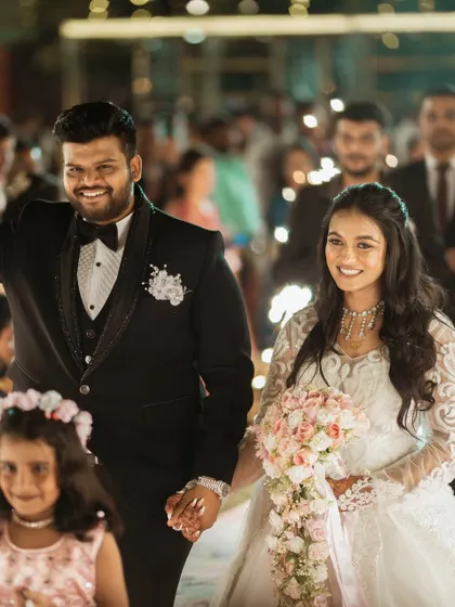 The grand entrance of the bride and groom at their reception.