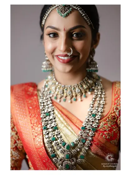 A detailed shot of the exquisite jewelry and makeup. I teach my students how to apply makeup that complements, rather than competes with, heavy traditional jewelry.