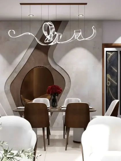 This dining area showcases a stunning, multi-layered wall feature with organic shapes and a modern, artistic chandelier. The design creates a dramatic and memorable backdrop for intimate dinners.
