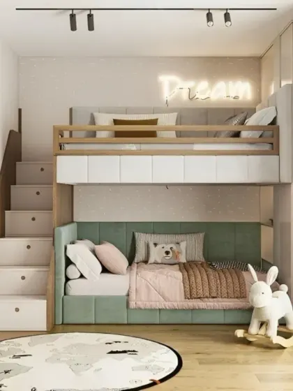 A modern and clean bunk bed design with a neutral color palette. The stairs include built-in drawers for storage, and the L-shaped configuration creates a cozy nook for the bottom bed.