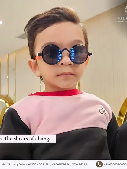 A haircut that deserves all the heart emojis. This little guy is rocking his new cut with some cool shades, embracing the shears of change.