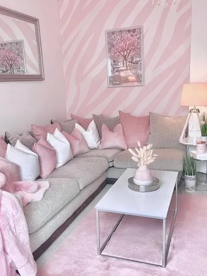 For a fun and modern living room, we created a bold zebra-stripe pattern in two shades of pink. This shows how patterned walls can be used to express personality and create a truly unique and energetic space.