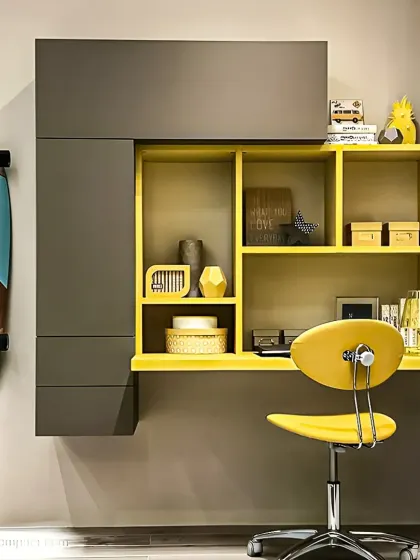 A vibrant and modern study unit with a bold yellow and grey color scheme. The floating desk and asymmetrical shelving create a playful yet functional workspace.
