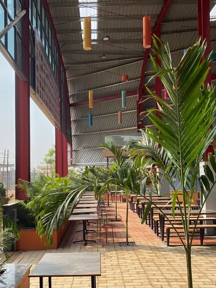 The "Foods Arena" in Hubballi is a large, open food court I designed using a Pre-engineered Building (PEB) system. The red superstructure and interior landscaping create a vibrant and welcoming public space.
