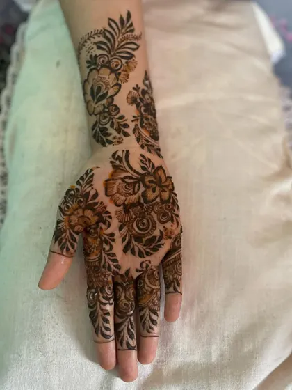 A treat for my sister. This design features a beautiful floral vine that trails from her wrist down to her fingers.