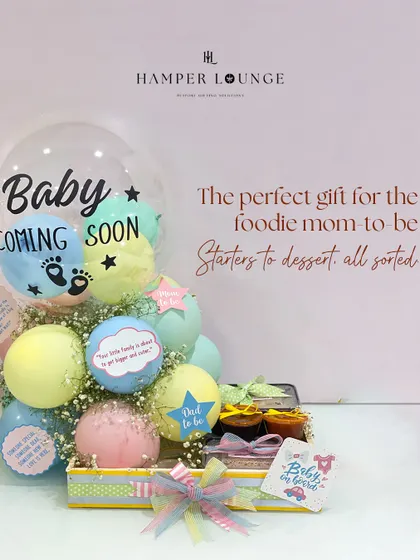 For the foodie mom-to-be, this hamper is the perfect indulgence. I arranged for a complete meal from her favorite restaurant, Yauatcha, including starters, mains, and desserts, and presented it with festive balloons and decorations for her baby shower.