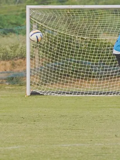 A player lining up for a free-kick. A great opportunity to score.
