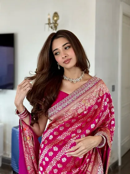 A confident pose showing off the full look. The makeup is fresh and radiant, perfect for a daytime engagement ceremony.