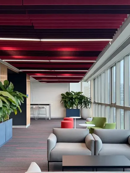 This pre-function space for a corporate conference center was designed to be clean and vibrant, but not overwhelming. We used a colorful baffled ceiling and lush planters to create a welcoming transition zone that is both professional and refreshing.