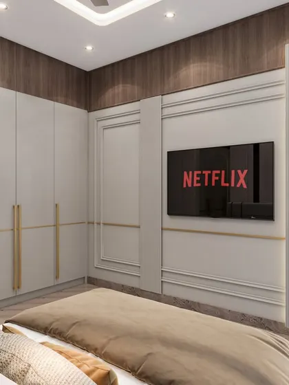 The TV unit wall in the parent's room, featuring classic molding and modern sconce lighting. The design blends timeless elements with contemporary touches for a luxurious feel.