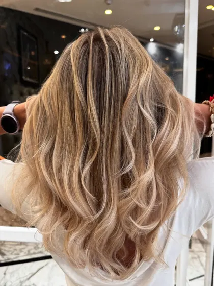 Another angle of the platinum blond blend, capturing the hair's healthy shine and beautiful cool tones.