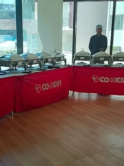 A complete lunch buffet setup for a house party at Shriram Blue apartment complex.
