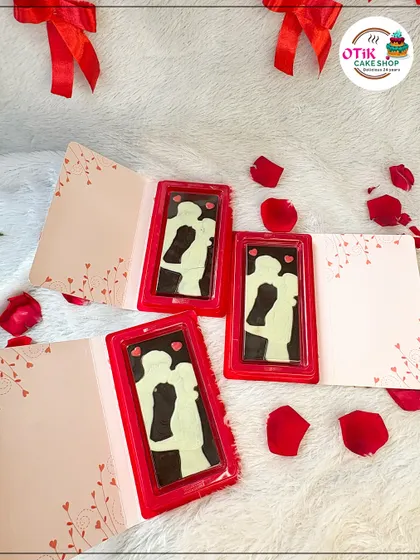 A unique Valentine's gift: a chocolate bar card. The solid chocolate bar features a silhouette of a couple, and it comes inside a greeting card where you can write your own message.