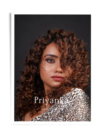 A portrait of our student Priyanka with her curly-haired model, a highlight from our student portfolio shoots.
