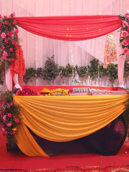 A closer view of a functional yet decorative station at the event, showing how we incorporate theme colors and flowers into every element.