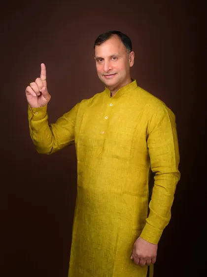 A portrait with a gesture emphasizing a key point. This is effective for political imagery, suggesting clear communication and conviction.
