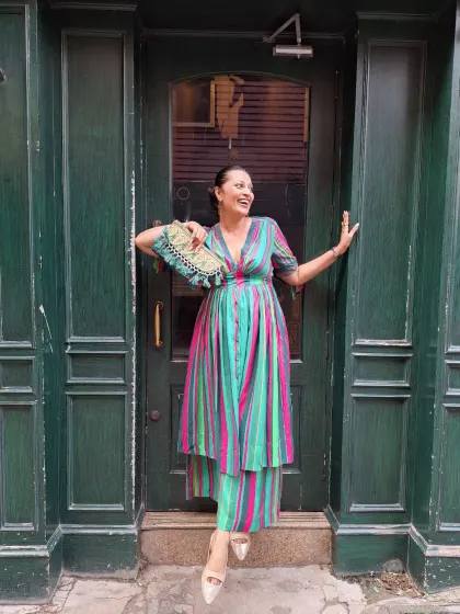 A vibrant striped co-ord set that’s full of personality. The combination of the dress and matching trousers is a unique take on modern ethnic wear, perfect for making a statement.
