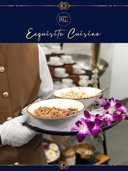 A server holding a tray with bowls of roasted almonds and cashews. This simple gesture of hospitality ensures guests have something to nibble on throughout the event.