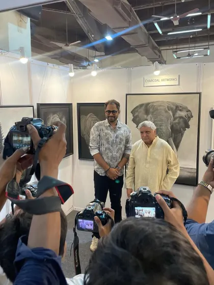 Posing for the press with Javed Akhtar saab in front of my elephant artwork. It was a memorable day with significant media attention.