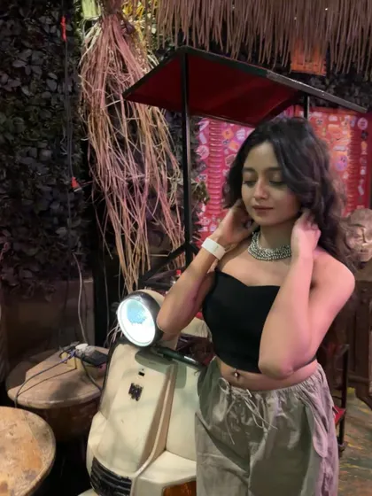 Getting into the weekend mood. A cool setting with a vintage scooter makes for a great photo op before the night really begins.