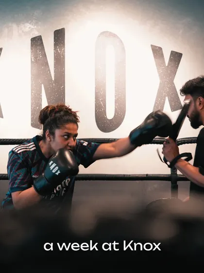 Step into the ring and find your fire. This shot captures the intensity and focus of a one on one boxing session, where our coach works with a client on pad drills to sharpen technique, power, and speed.