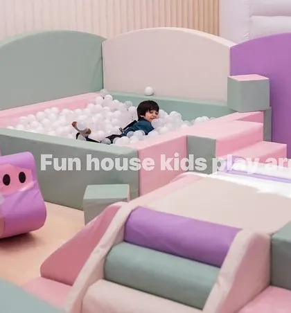 A child enjoying the pastel ball pit. All our equipment is made from soft, high-quality foam to ensure a safe play experience.