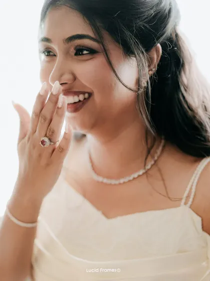A candid shot of the bride's happy and surprised reaction, a genuine moment of joy.