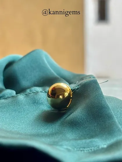 For the man who appreciates minimalist elegance, I crafted these simple yet striking spherical gold cufflinks. Their high-polish finish reflects light beautifully, adding a touch of understated class to this teal green shirt.