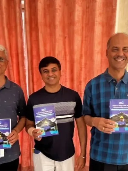 Three happy customers holding our solar guide. The ripple effect of one person going solar often inspires neighbors to do the same.