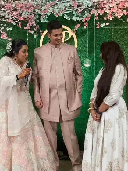 Discussing last-minute details with the couple on stage. My job is to make sure they feel completely at ease.