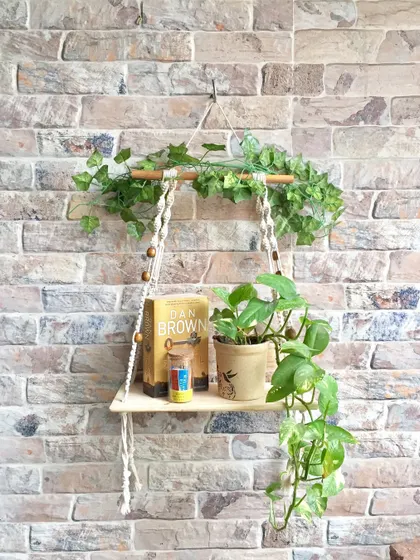 This is one of my favorite ways to use macrame. A simple hanging wall shelf adds so much life to a bare wall. It’s perfect for holding a small plant, a few books, or your favorite decorative items, bringing a touch of handmade warmth to your space.