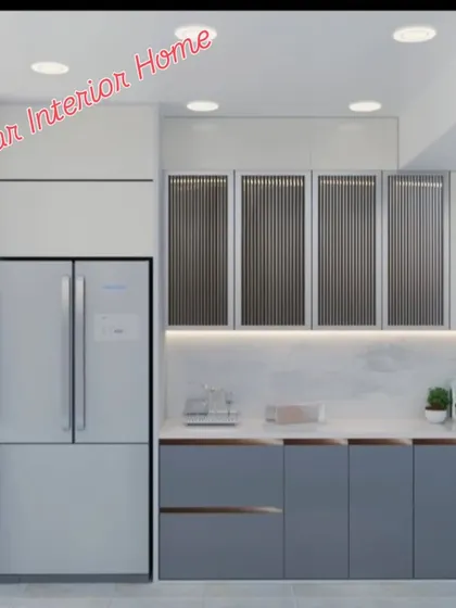 A sophisticated modular kitchen in shades of grey and white, with fluted glass upper cabinets and under-cabinet lighting.