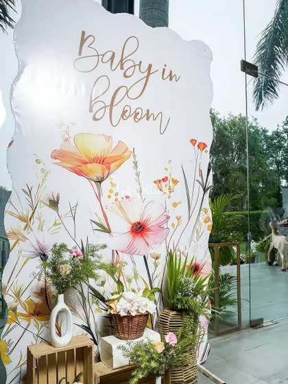 A beautiful watercolor-style welcome sign for the 'Baby in Bloom' shower.