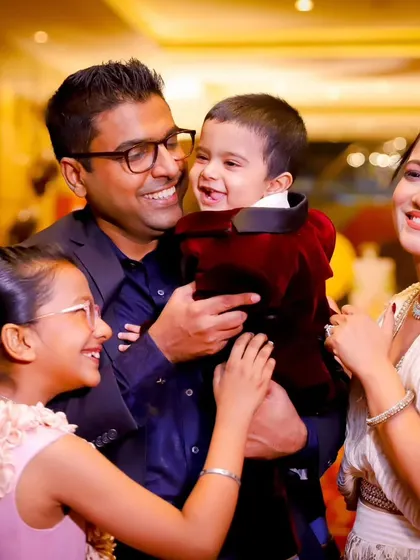 A complete family portrait filled with smiles. We love capturing the joy of the parents and siblings as they celebrate the youngest member's milestone birthday.