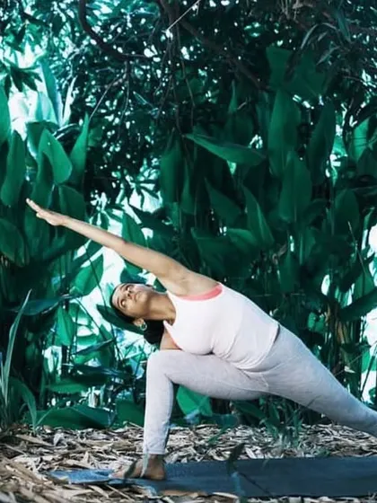 Utthita Parsvakonasana (Extended Side Angle Pose) amidst nature. This powerful standing pose strengthens the legs and creates a long line of energy from the foot to the fingertips.