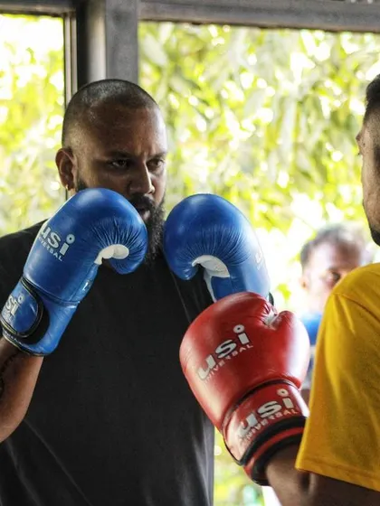 Two fighters squaring off, reading each other before the action starts. The mental game of boxing begins before a single punch is thrown.