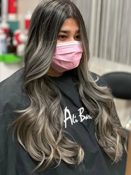 The client wearing a mask, but her stunning new ash hair is on full display.