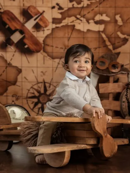 A charming portrait of the little aviator, showcasing the detailed vintage props and the "ONE" blocks celebrating his milestone.