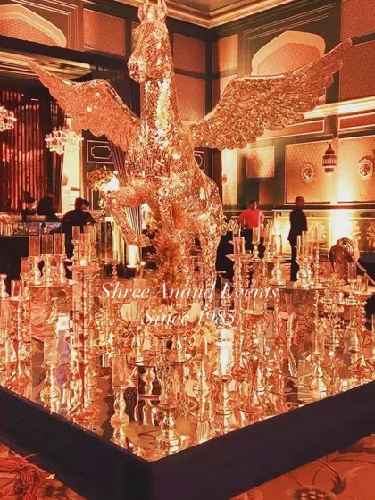 For a touch of fantasy and pure opulence, we design unique statement pieces like this golden, crystal-encrusted winged horse. It’s this kind of imaginative decor that makes our events truly unforgettable.