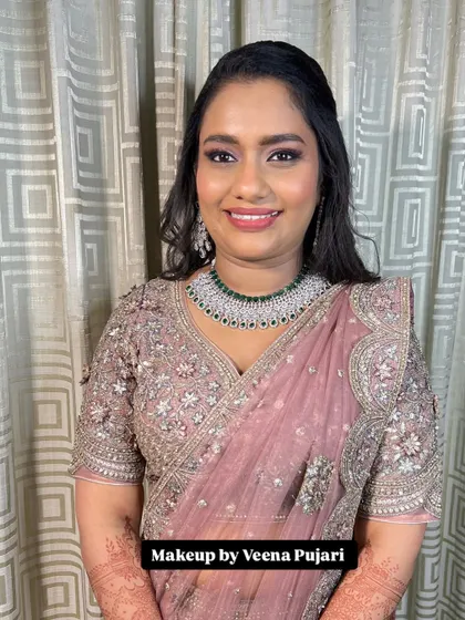 Ambar looking radiant for her reception. The soft, shimmery eye makeup and glowing skin create a look that is both elegant and modern.