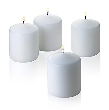 Four small, lit votive-style pillar candles. These are perfect for scattering around a room or using in holders to create a magical, twinkling effect.