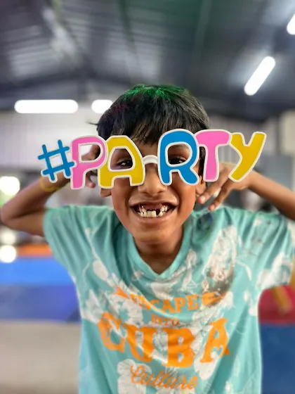 Dangerously cute and irresistibly mischievous. This student's big smile and party glasses perfectly capture the fun-loving spirit of our studio.
