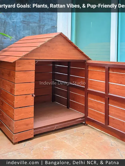 The custom doghouse with its door open, showing the spacious and well-built interior. I believe in creating functional designs that cater to every member of the family.