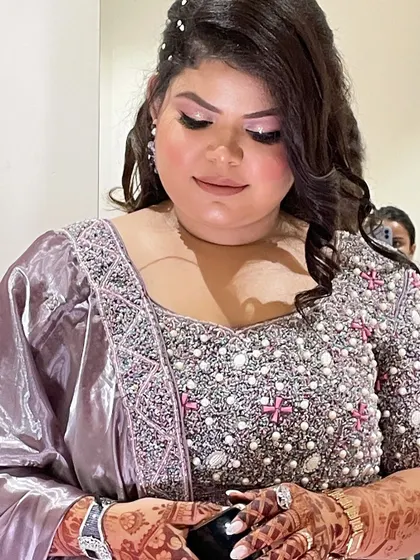 Another close-up showing the beautiful details of her blouse and the flawless finish of her makeup.