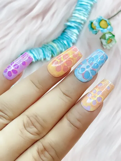 The full set of the pastel 3D floral nails, showcasing the different color combinations on each nail.