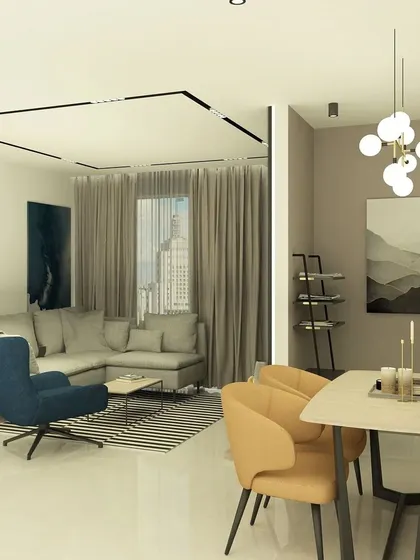 This render highlights the dining area adjacent to the living room, featuring modern art and a simple, elegant chandelier.