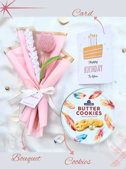 A simple and sweet birthday surprise. This gift set combines a single pink crochet tulip bouquet with a tin of classic butter cookies and a birthday card.