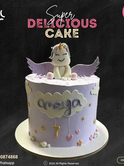 A dreamy unicorn cake for a 7th birthday. This lavender-colored cake is adorned with stars, hearts, and a cute winged unicorn sitting on a cloud, creating a truly magical feel.