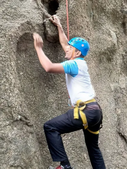 A close-up of a climber from the Air Force camp finding his next handhold.