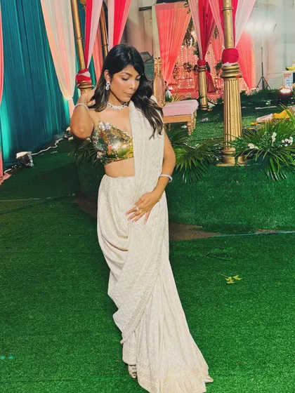 A full-length view of my custom-draped pant-saree at a wedding venue. This shows how an unconventional drape can create a stunning and memorable silhouette.